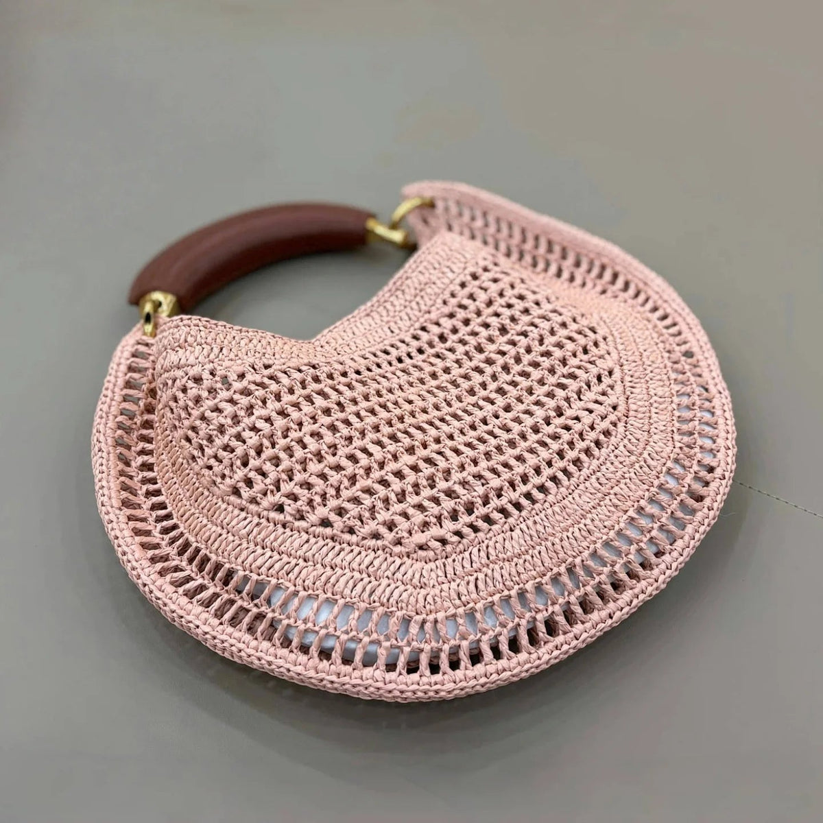 Sabine Halbmondförmige geflochtene Tasche