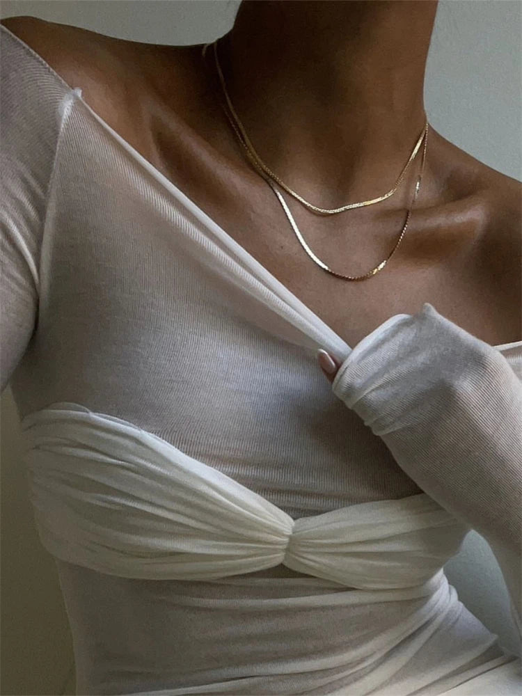 Saras durchsichtiges Mesh-Off-Shoulder-Top